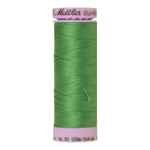 A spool of vibrant green cotton thread - code 1314