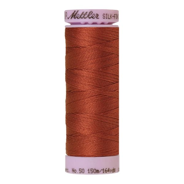 Spool of copper coloured cotton thread - Dirty Penny code 1347