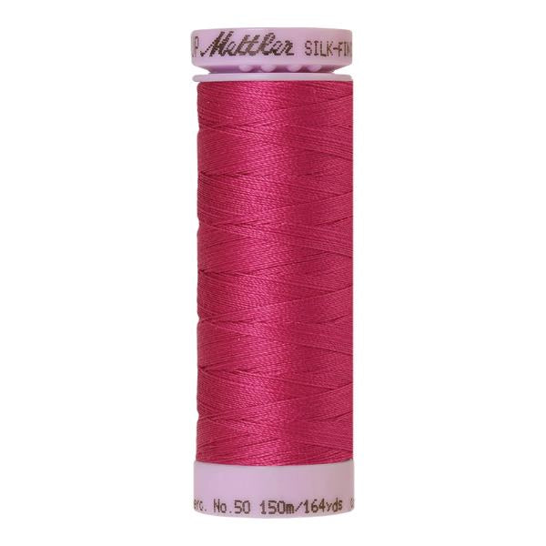 Spool of cotton thread in peony pink - code 1417