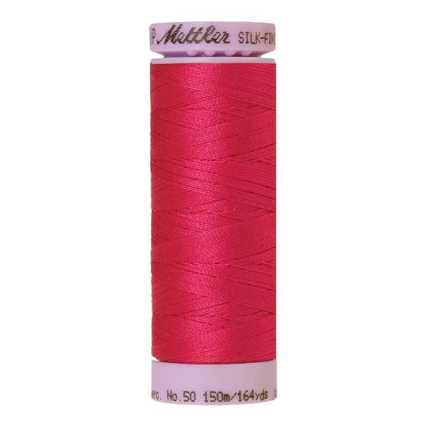 Spool of Mettler Silk Finished Cotton Thread in colour Fuschia 1421