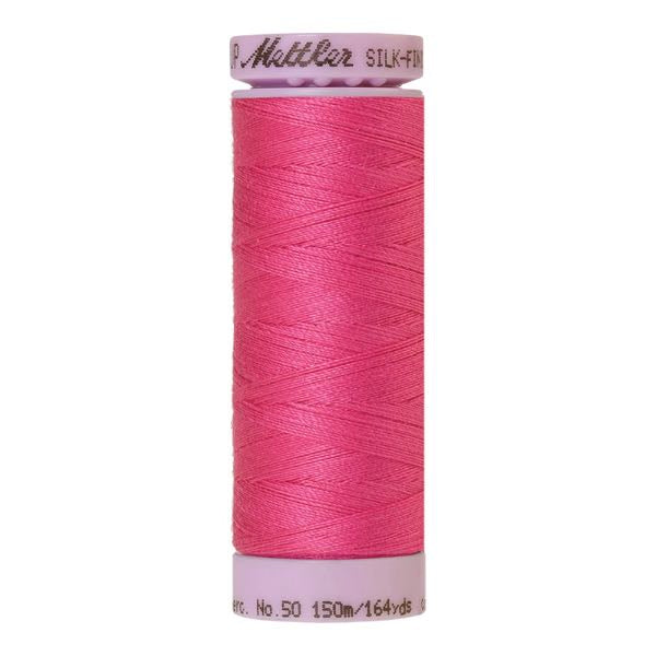 Spool of hot pink coloured cotton thread - code 1423