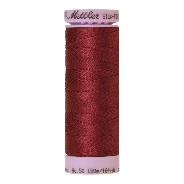 Spool of claret coloured cotton thread - code 1461