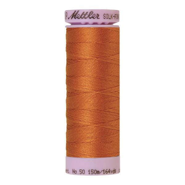 Spool of burnt orange coloured cotton thread - Golden Oak code 1533