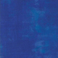 Deep blue coloured quilting fabric with a grunge distressed look